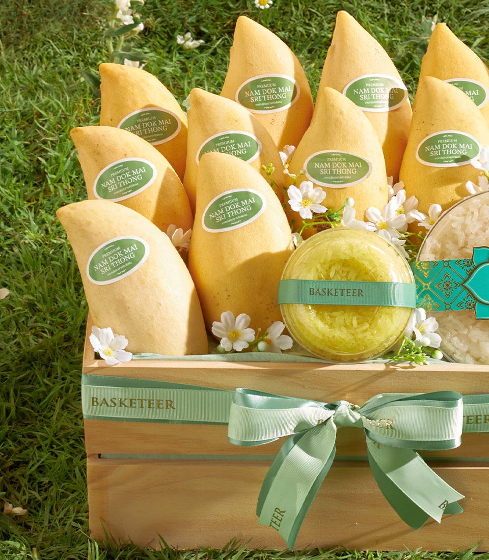 Premium Nam Dok Mai mango gift basket with sticky rice, individually wrapped yellow mangoes in wooden crate
