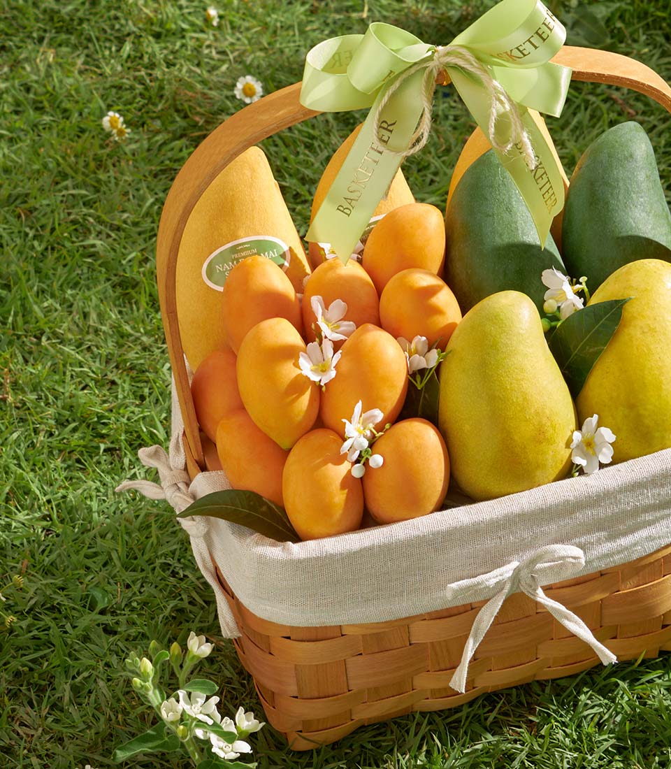 Premium Thai mango and tropical fruit gift basket with woven wicker and beige linen