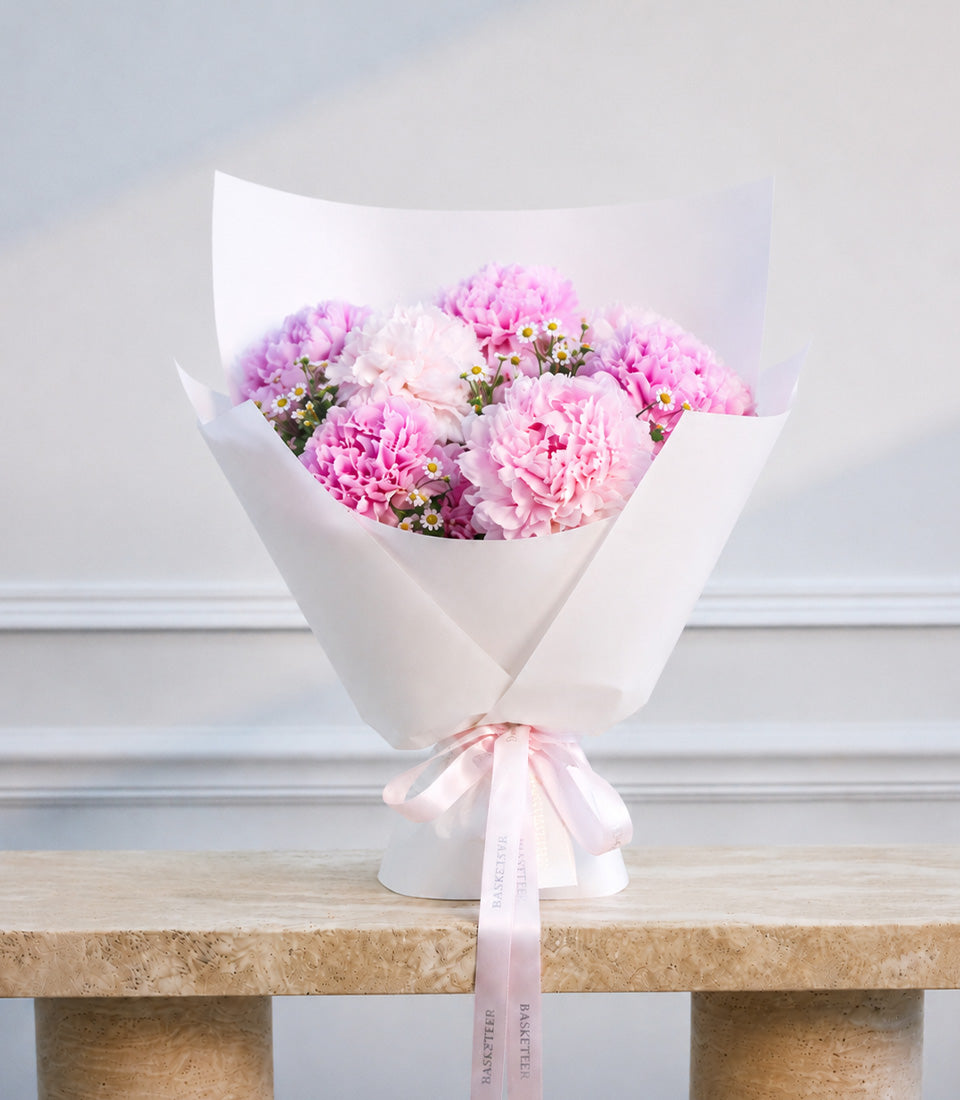 A luxurious bouquet of vibrant pink peonies and delicate white daisies from Flowers