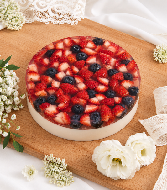 Charlotte Bakery's artisan round jelly cake featuring a creamy coconut base
