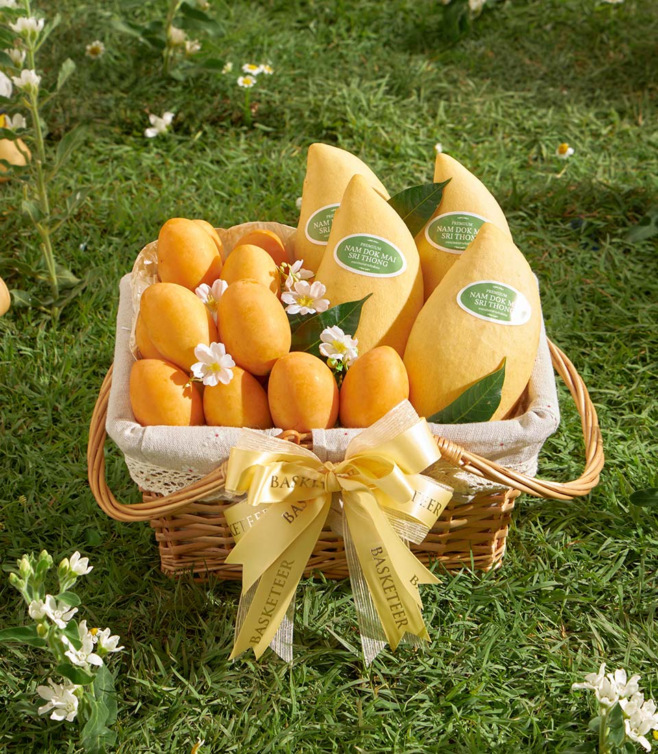 Premium Nam Dok Mai mango and Mayongchid fruit gift basket with white flowers and yellow ribbon