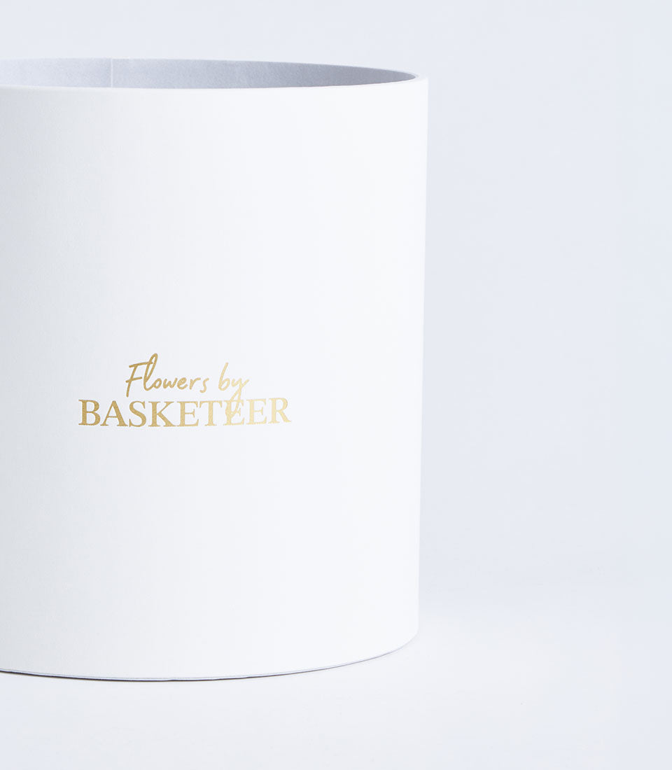 Basketeer's premium round white gift box, featuring elegant