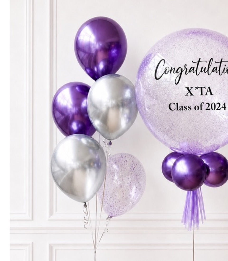 Purple and silver metallic balloons with glittery purple tulle balloon, congratulations message for X'TA Class of 2024 graduation decoration.
