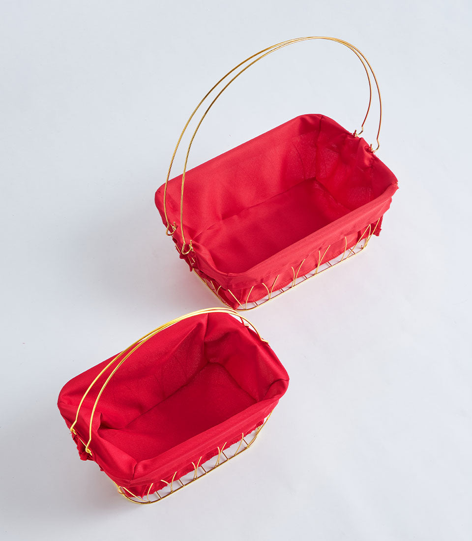 Gold wire frame basket with red fabric lining and dual handles, luxury gift hamper collection