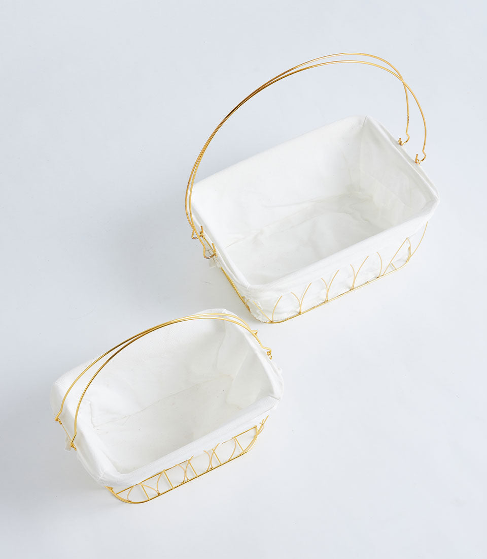 Gold metal frame baskets with white fabric liners and arched handles, set of two