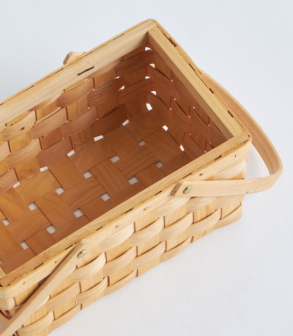 Natural bamboo rectangular basket with woven design and dual wooden handles for premium gift presentation