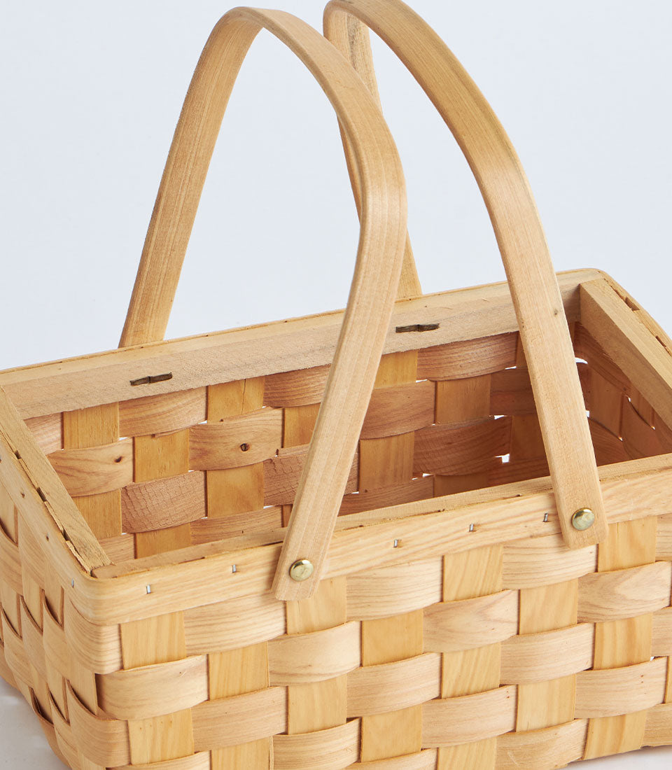 Natural bamboo rectangular gift basket with dual arched handles and brass rivets