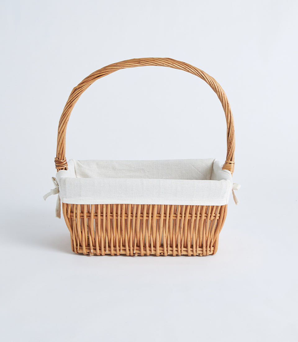 Natural wicker rectangular basket with cream lining and handle for luxury gift hampers