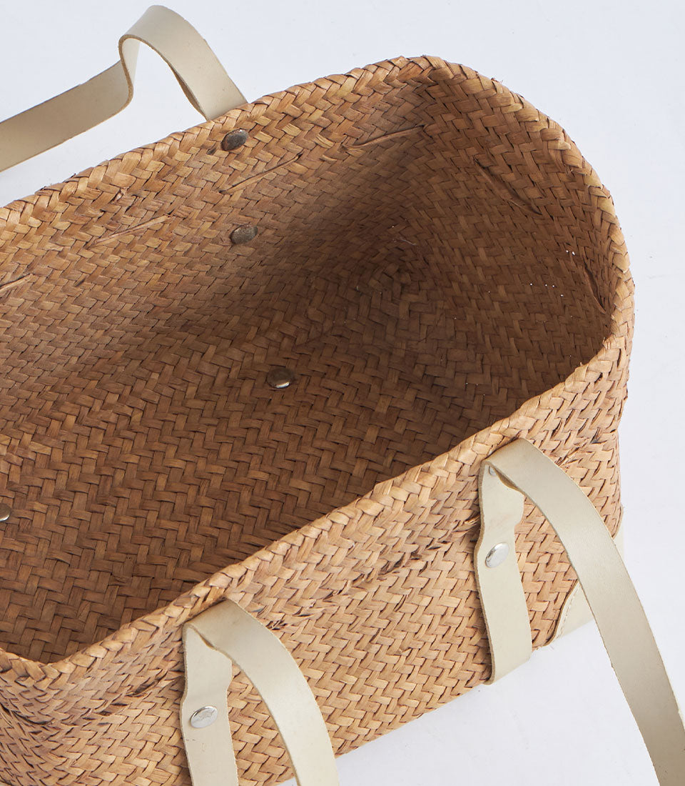 Natural woven oval basket with cream leather double strap handles
