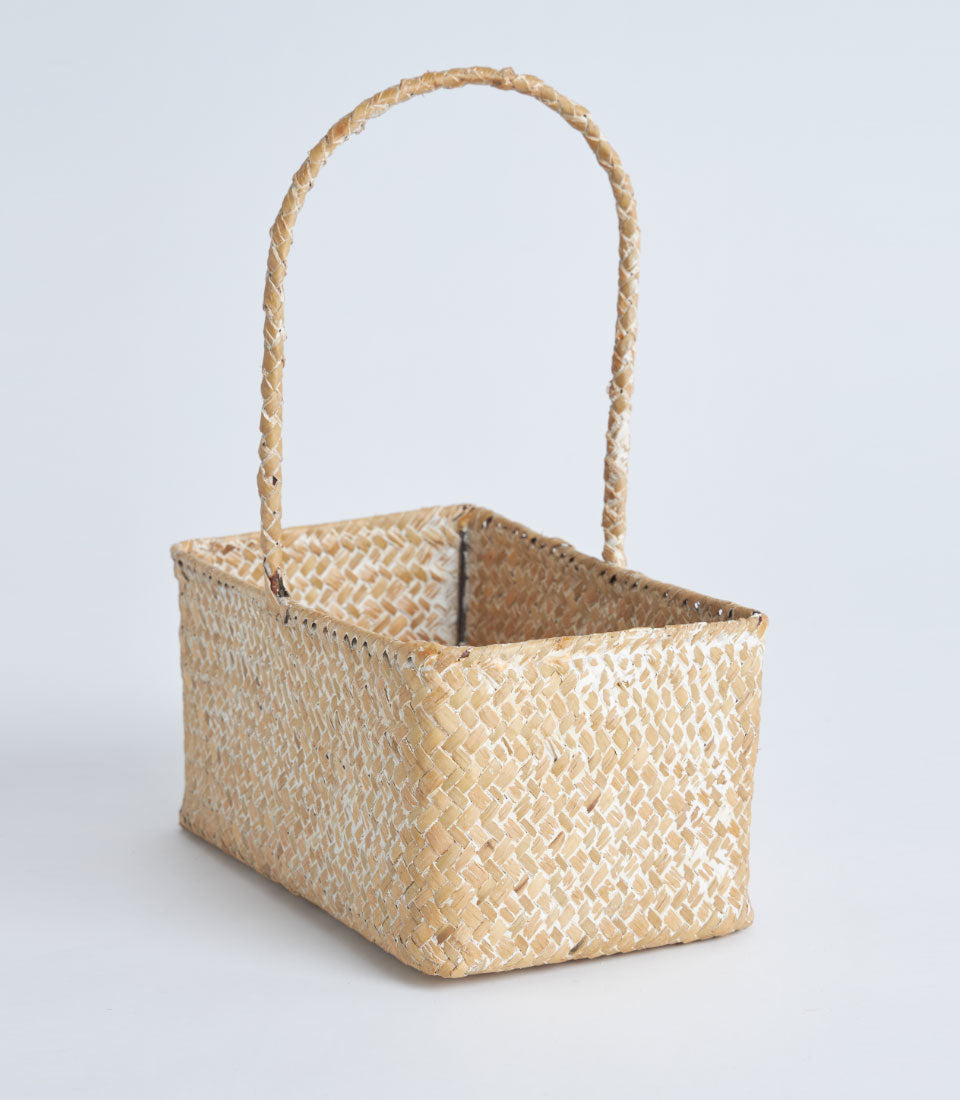 Light natural woven rectangular basket with braided handle for gift hampers
