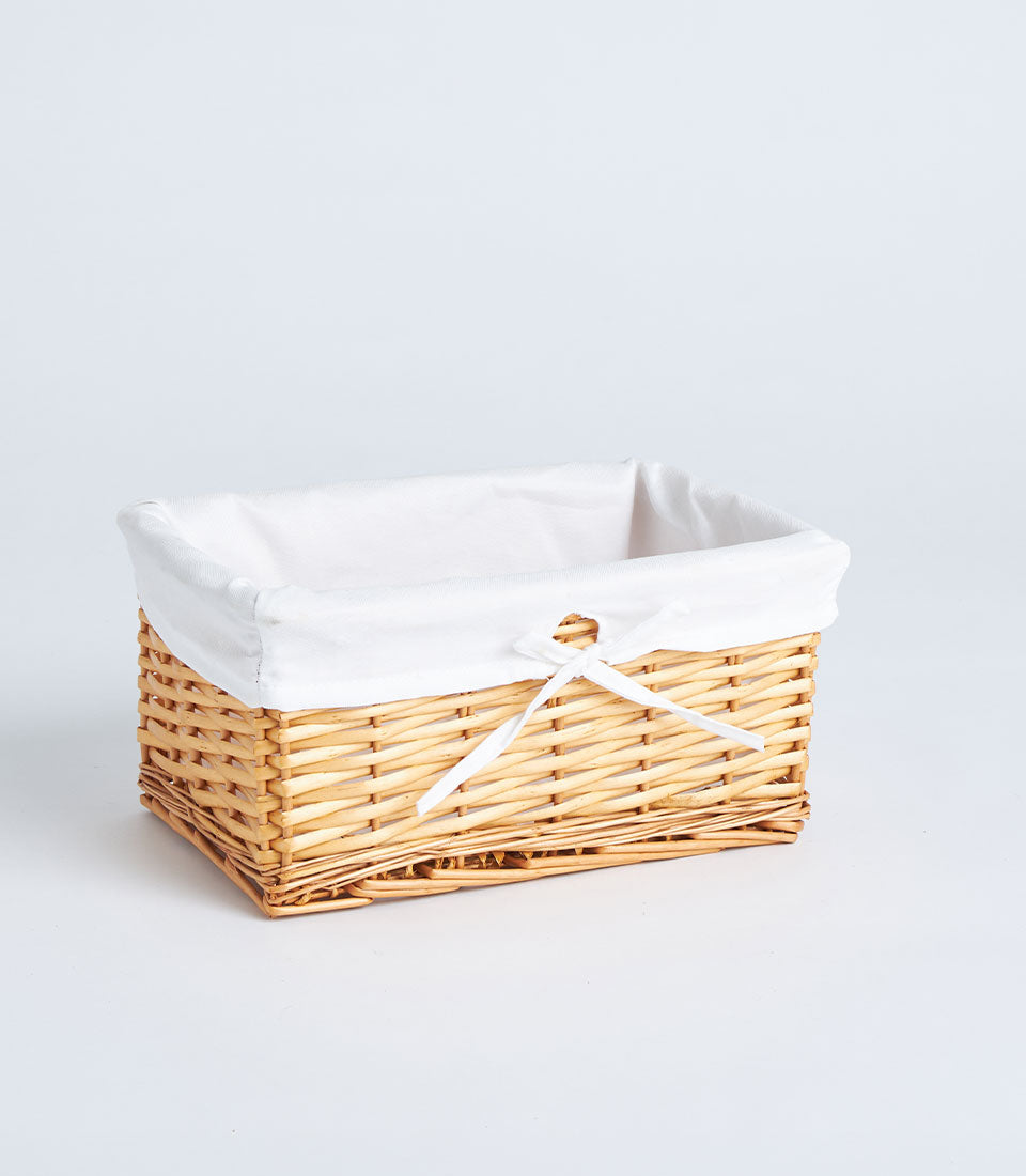 Basketeer's premium handwoven natural wicker basket with a white linen liner