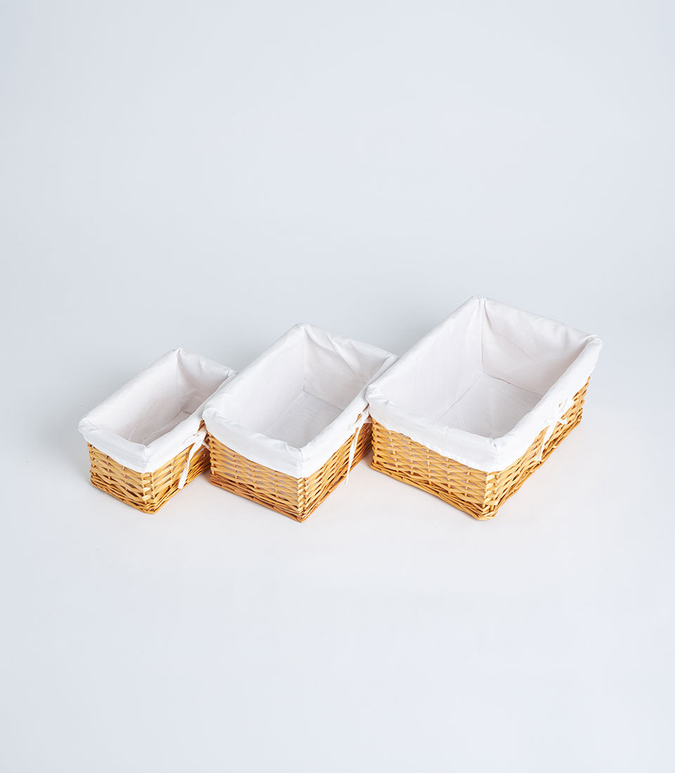 Basketeer's premium selection of three handwoven wicker baskets with crisp white
