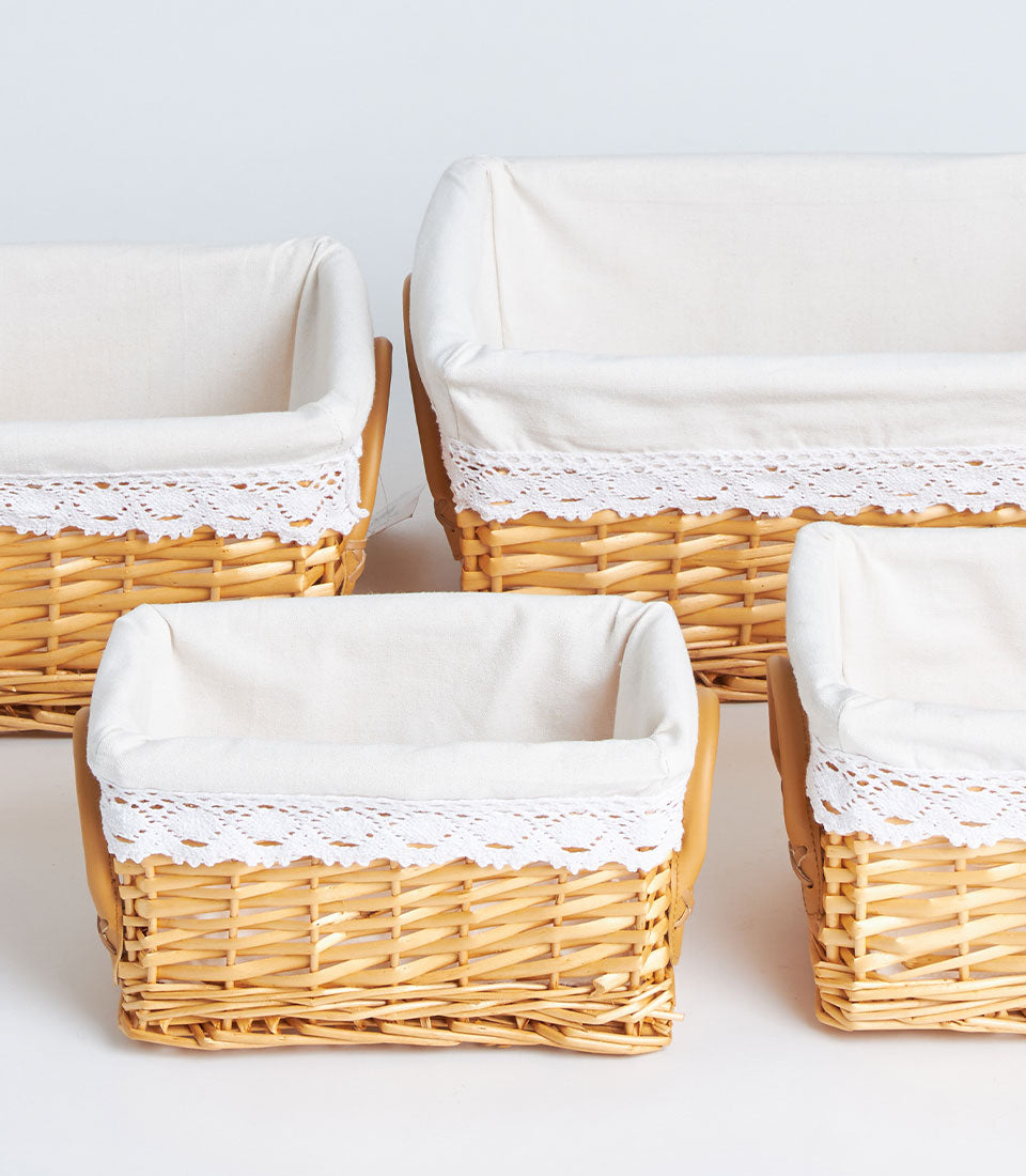 Basketeer's charming handwoven wicker baskets, each featuring a cream