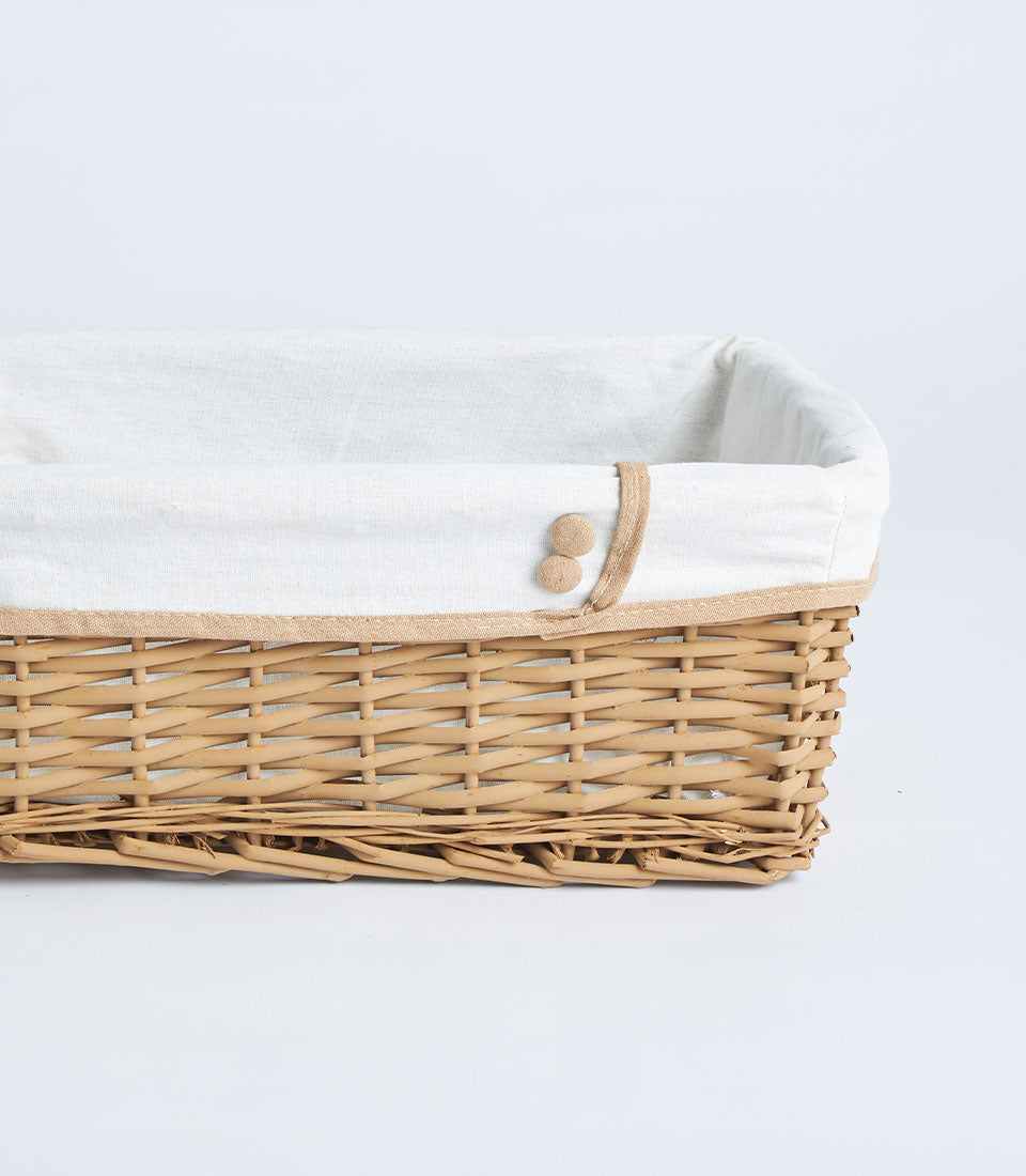 Basketeer's elegant handwoven wicker basket with a cream linen liner