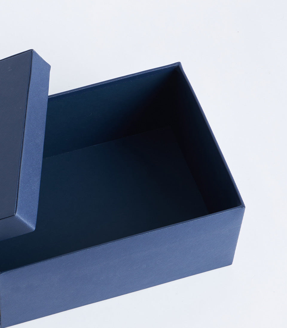 Navy leather storage box with open lid, premium gift packaging for Basketeer