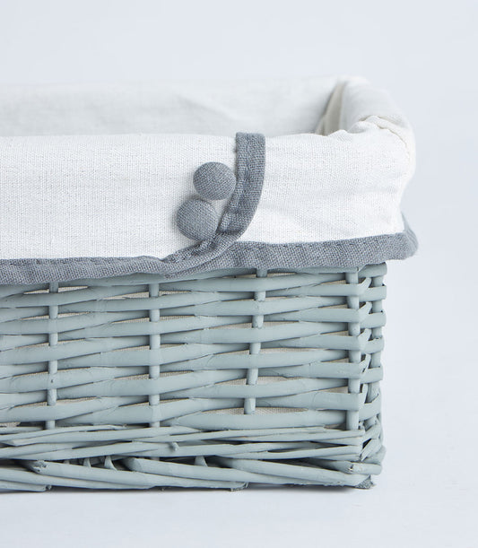 Basketeer's premium light grey wicker basket, featuring a soft white fabric