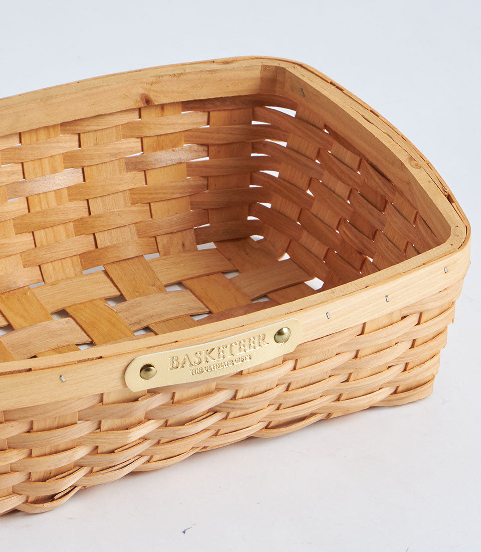 Natural bamboo oval weave basket with leather Basketeer tag, light tan woven storage hamper