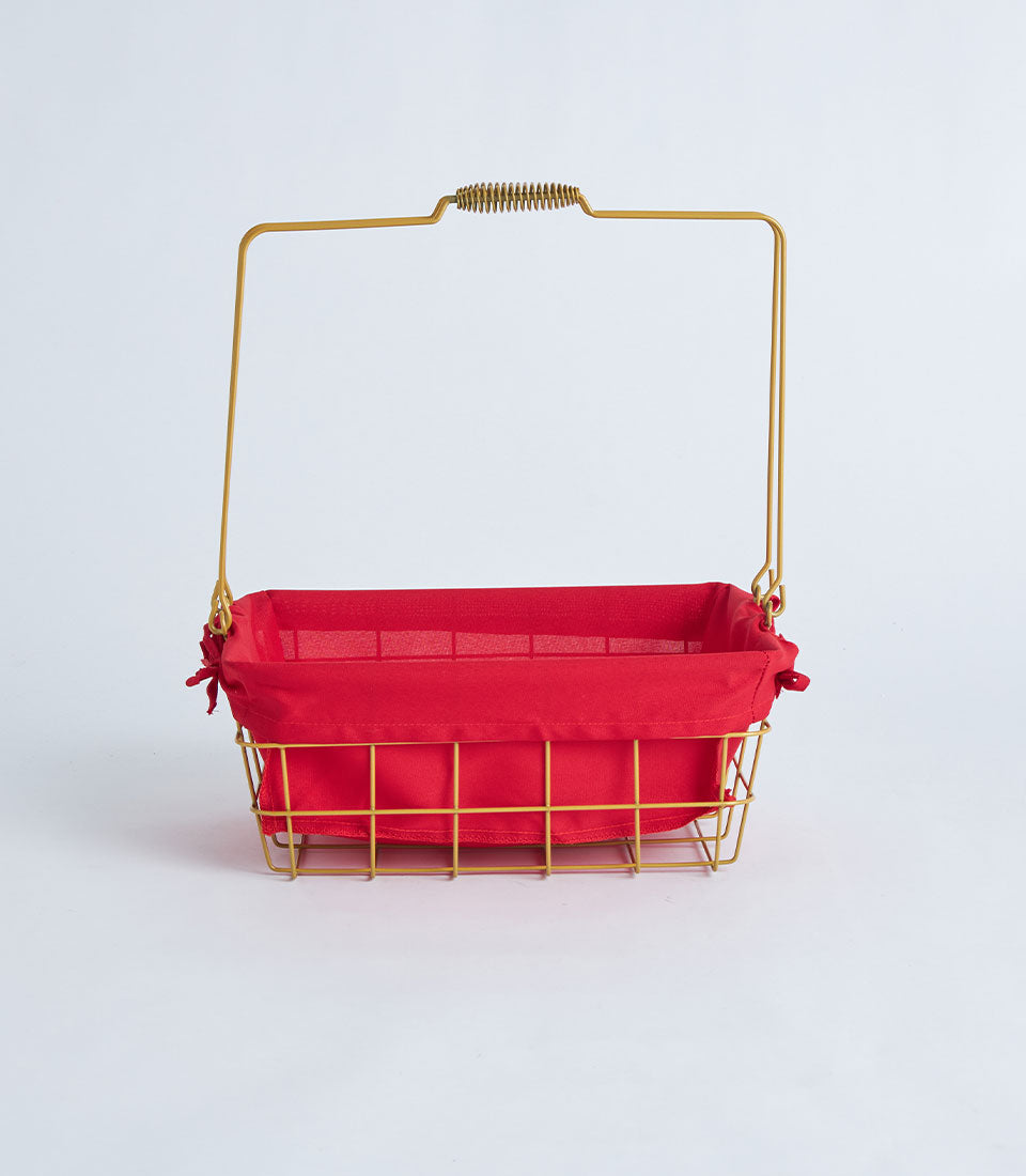 Gold wire basket with red fabric lining and arched handle, ideal for luxury gift hampers and premium presents