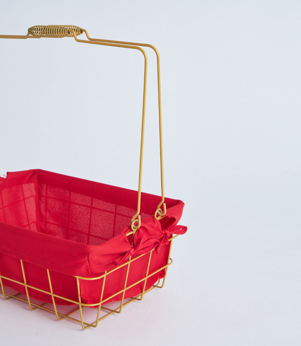 Gold metal wire basket with red fabric lining and handle for luxury gift hampers