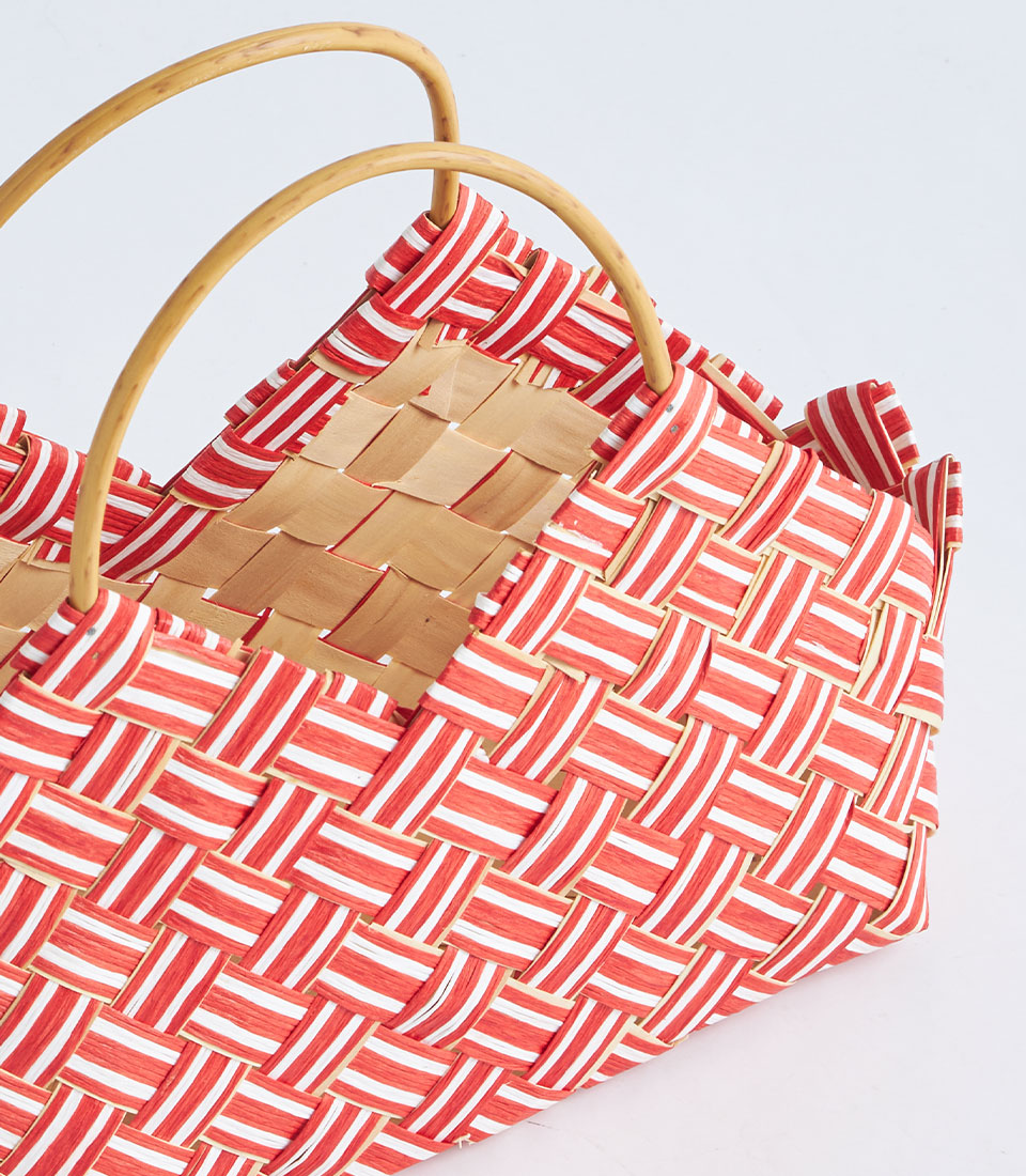 Red and white striped woven gift basket with natural wooden handles