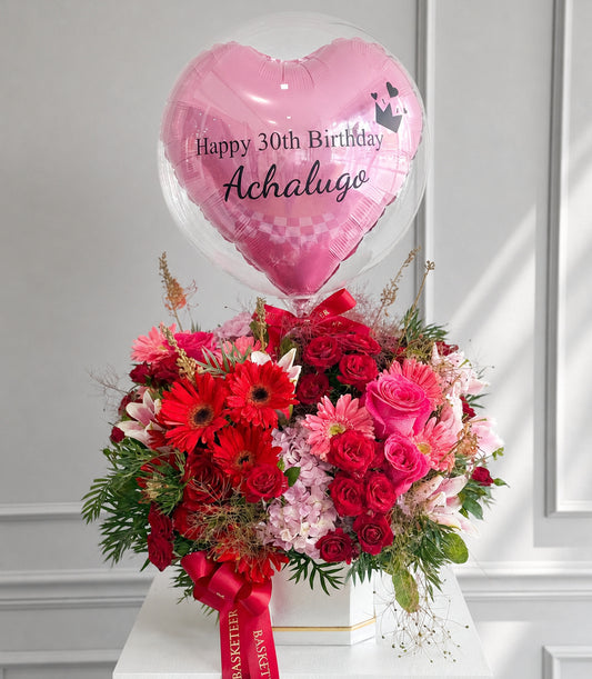 Basketeer luxury flower gift box with vibrant red gerberas, pink roses