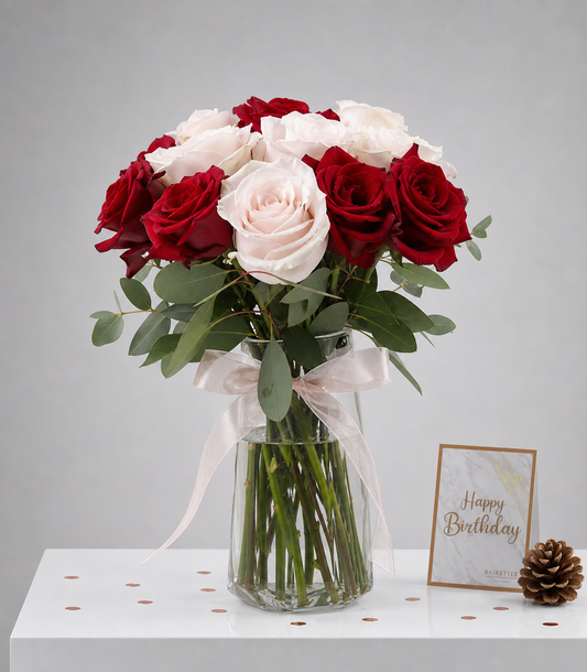 Elegant vase arrangement from Flowers by Basketeer featuring romantic deep red and blush pink roses