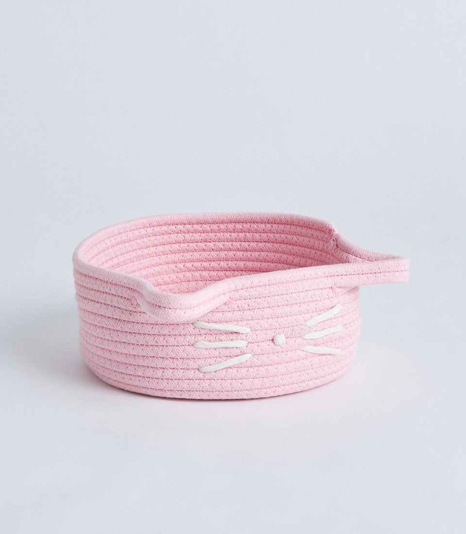 Pink cotton rope storage basket with embroidered cat face and handles