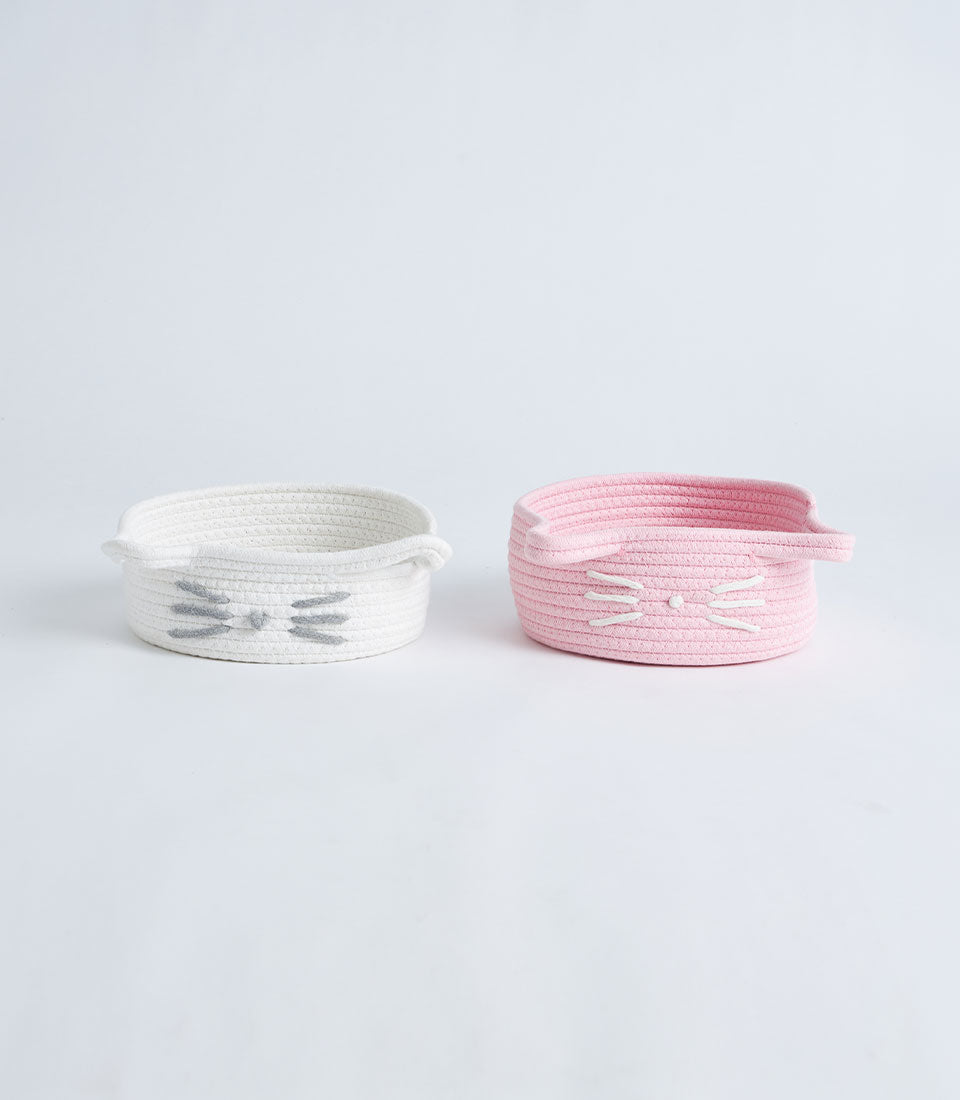 Pink and white cotton rope cat face storage baskets with embroidered whiskers and pointed ears