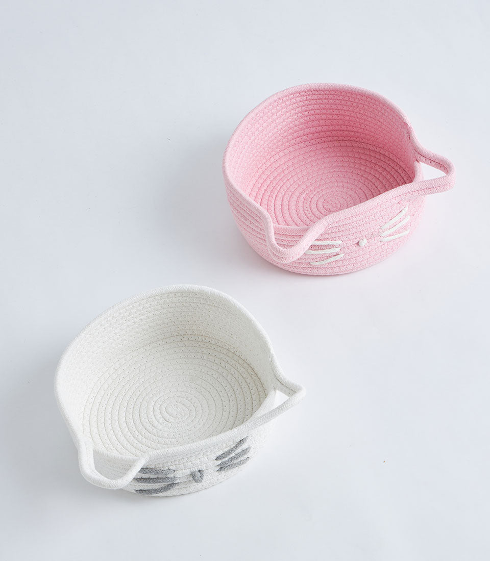 Pink and white cotton rope cat face storage baskets with embroidered whiskers and rope handles