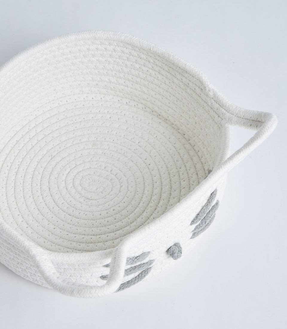White rope storage basket with cat face design and handles for home organization