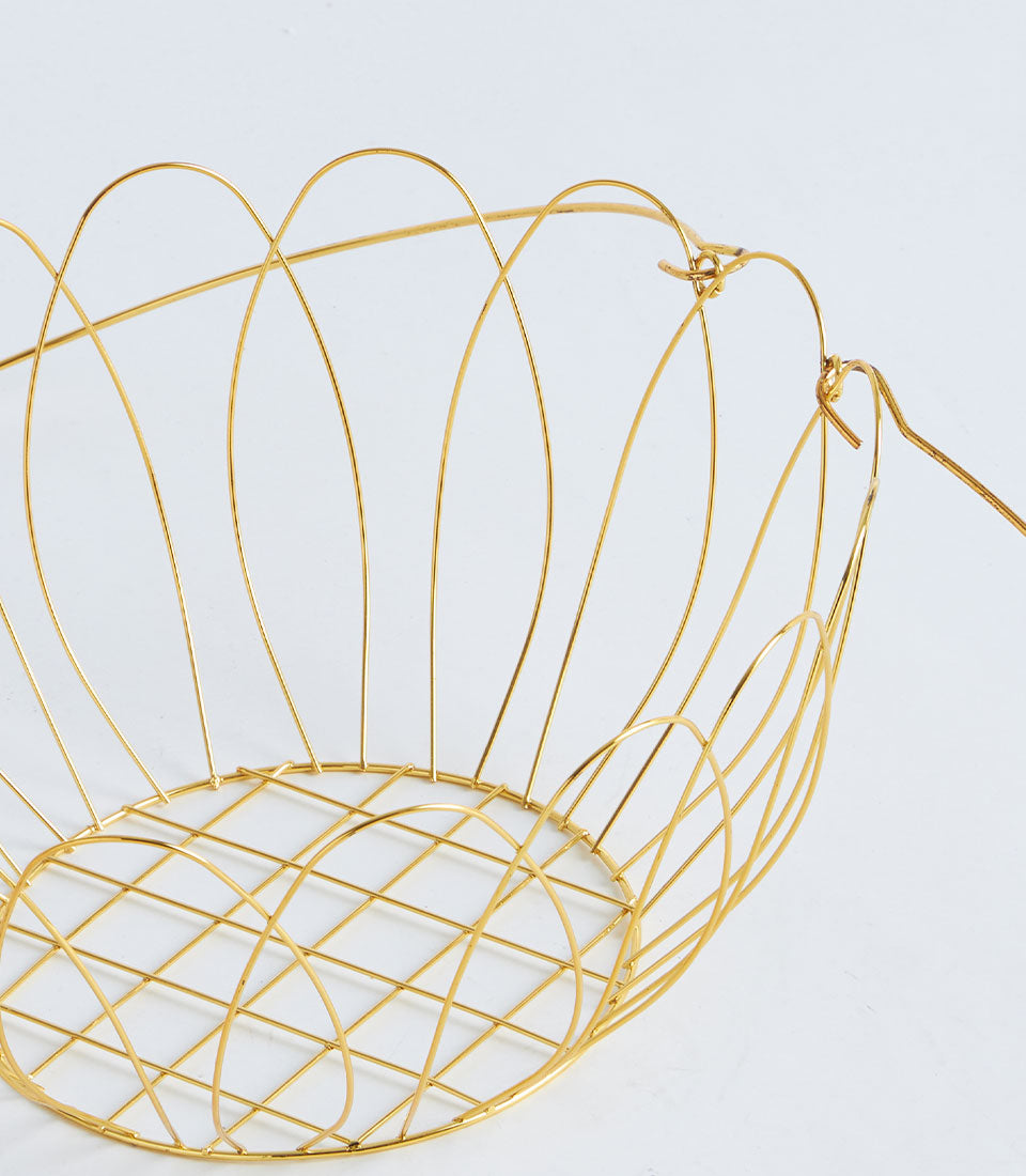 Gold wire fruit basket with arched handles and scalloped edges for elegant gifting