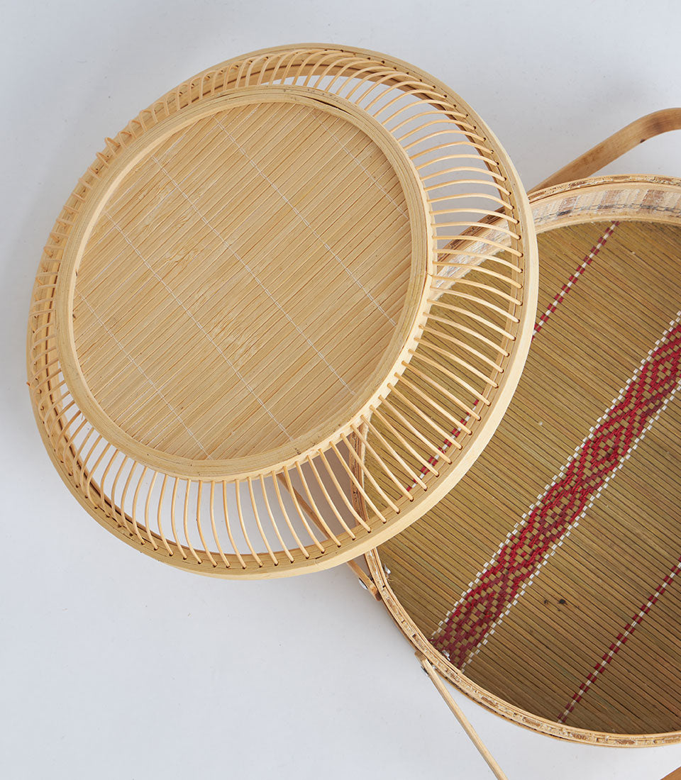 Natural woven bamboo round basket with wooden handle and lid for elegant gift storage