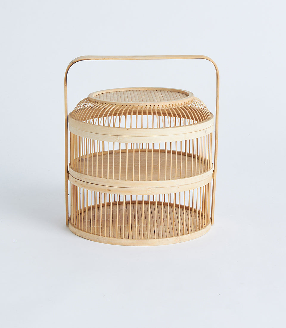 Natural bamboo two-tier display basket with curved handle, light wood artisan crafted storage