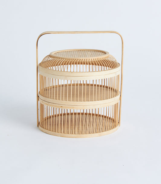 Natural bamboo two-tier display basket with curved handle, light wood artisan crafted storage