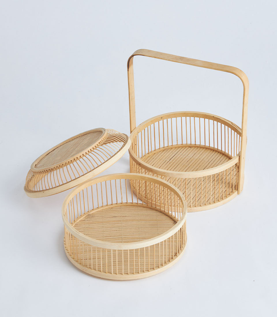 Natural bamboo two-tier display basket with handle and woven lid for serving and storage