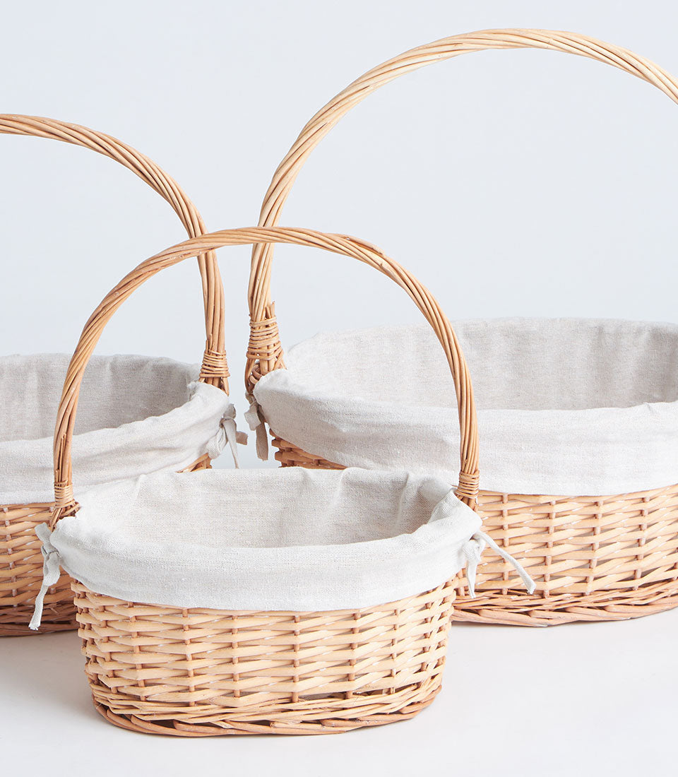 Natural wicker gift baskets with fabric liners and handles, three sizes for premium gifting