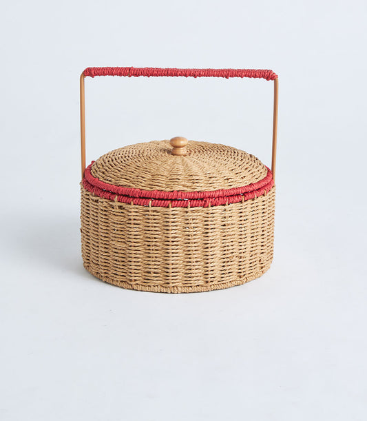 Natural woven raffia basket with domed lid and red trim handle, light tan artisan gift hamper container
