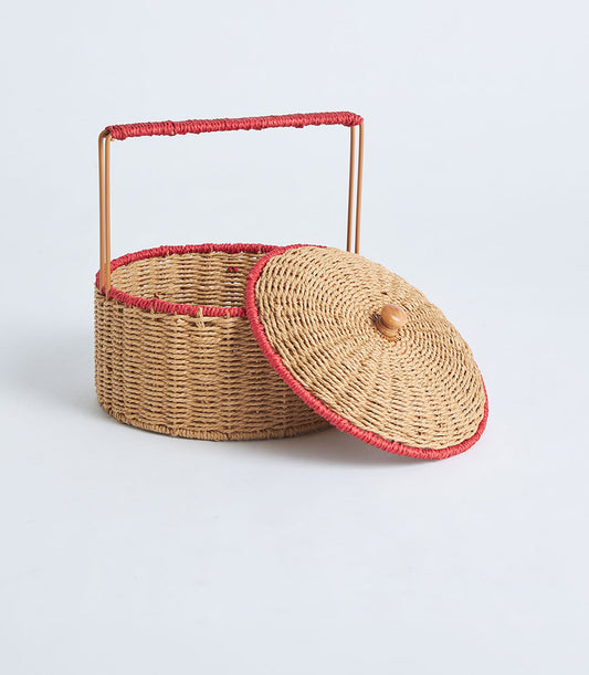Natural woven rattan basket with red-trimmed lid and handle for artisan gift presentation