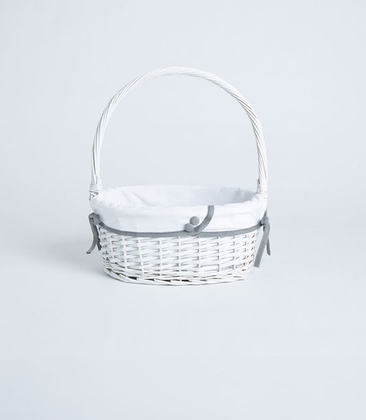 Handwoven white wicker basket with tall handle and fabric lining, tied with grey ribbon and decorative buttons