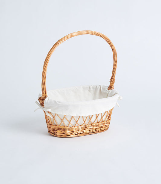 Natural wicker oval basket with lattice weave, white fabric lining, and braided handle