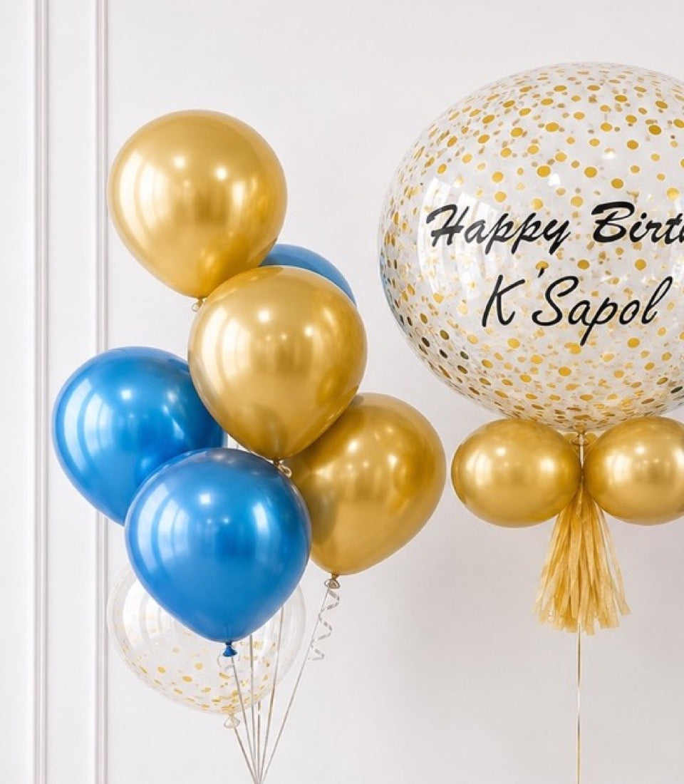 # Alt Text

Gold and blue metallic balloons with confetti-filled balloon displaying "Happy Birthday K'Sapol" text against white background.