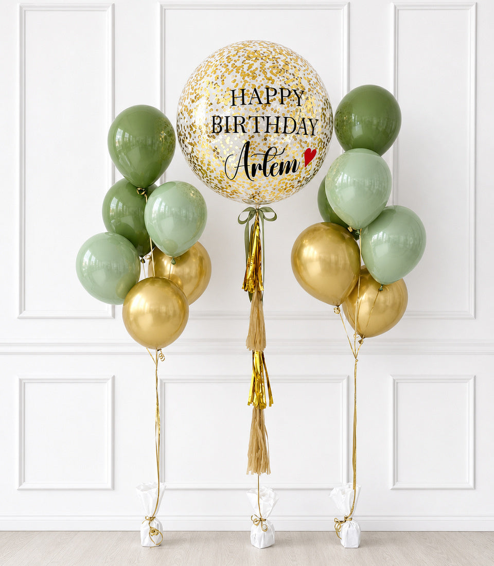 # Alt Text

Personalized birthday balloon bouquet with gold confetti centerpiece and sage green and gold latex balloons with gold tassels.