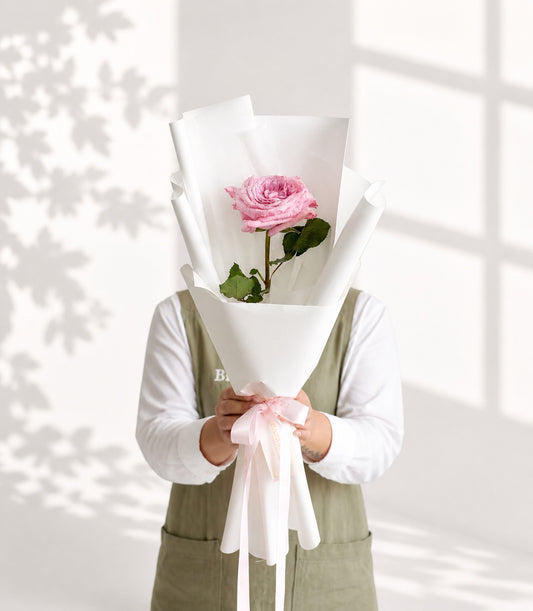 Elegant single pink rose bouquet from Flowers by Basketeer, beautifully wrapped