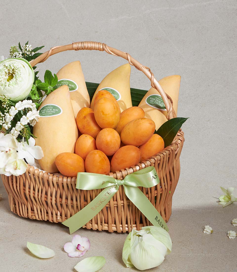 Lotus Heartfelt Joy wicker gift basket with premium Nam Doc Mai mangoes, fresh fruits, white lotus and orchid flowers, light