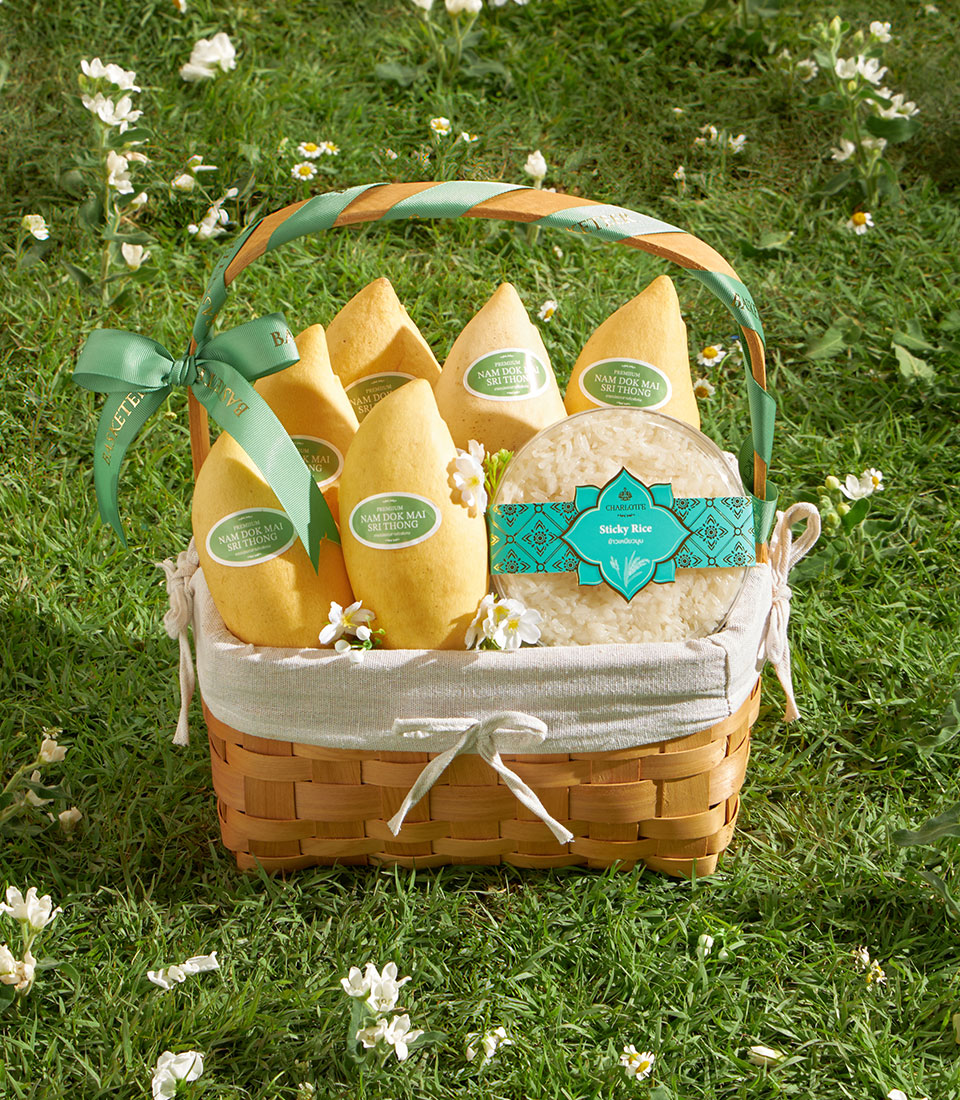 Premium Nam Dok Mai mango gift basket with sticky rice and artisan Thai treats in woven bamboo