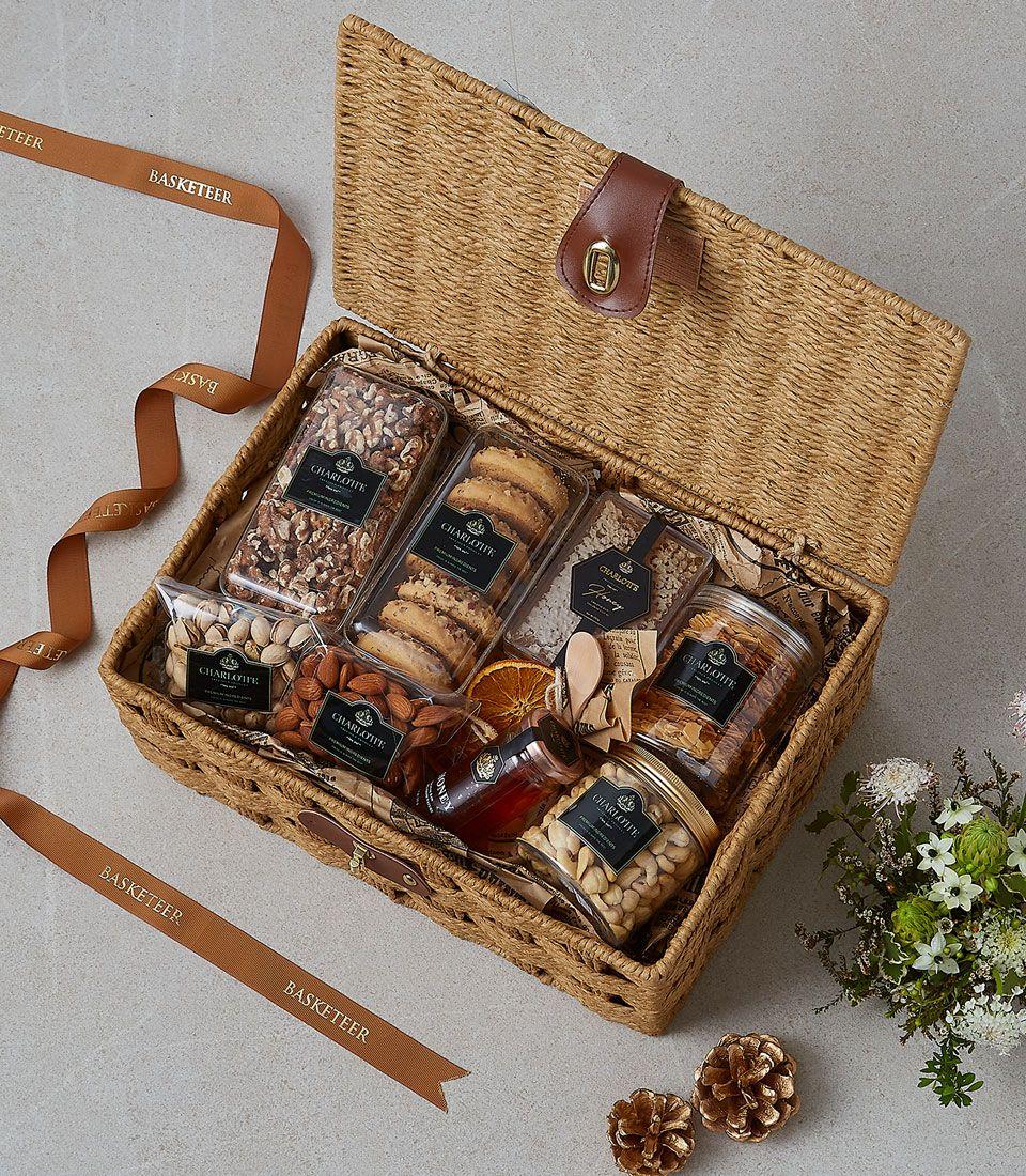 Warm Wishes wicker gift basket with gourmet nuts, granola, honey, and dried citrus