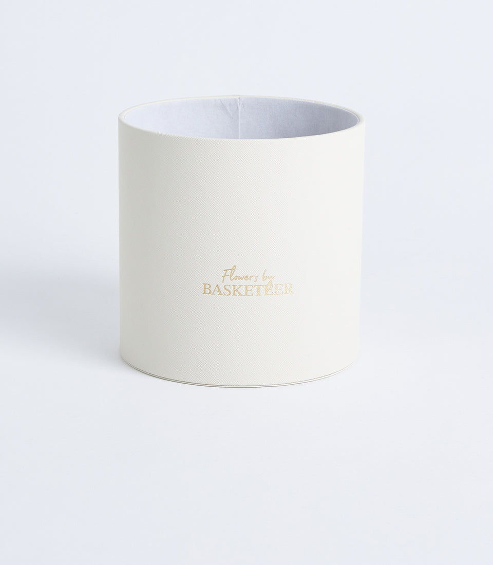 Ivory textured cylindrical flower gift box with gold foil branding