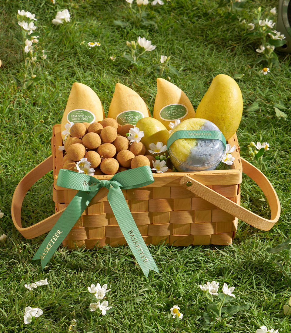 Premium mango and longan gift basket with sticky rice dessert, woven wood hamper tied with green ribbon