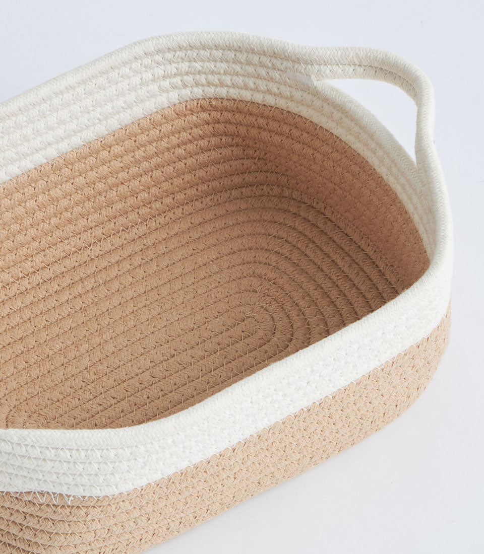 Beige and white woven rope storage basket with lid and handles
