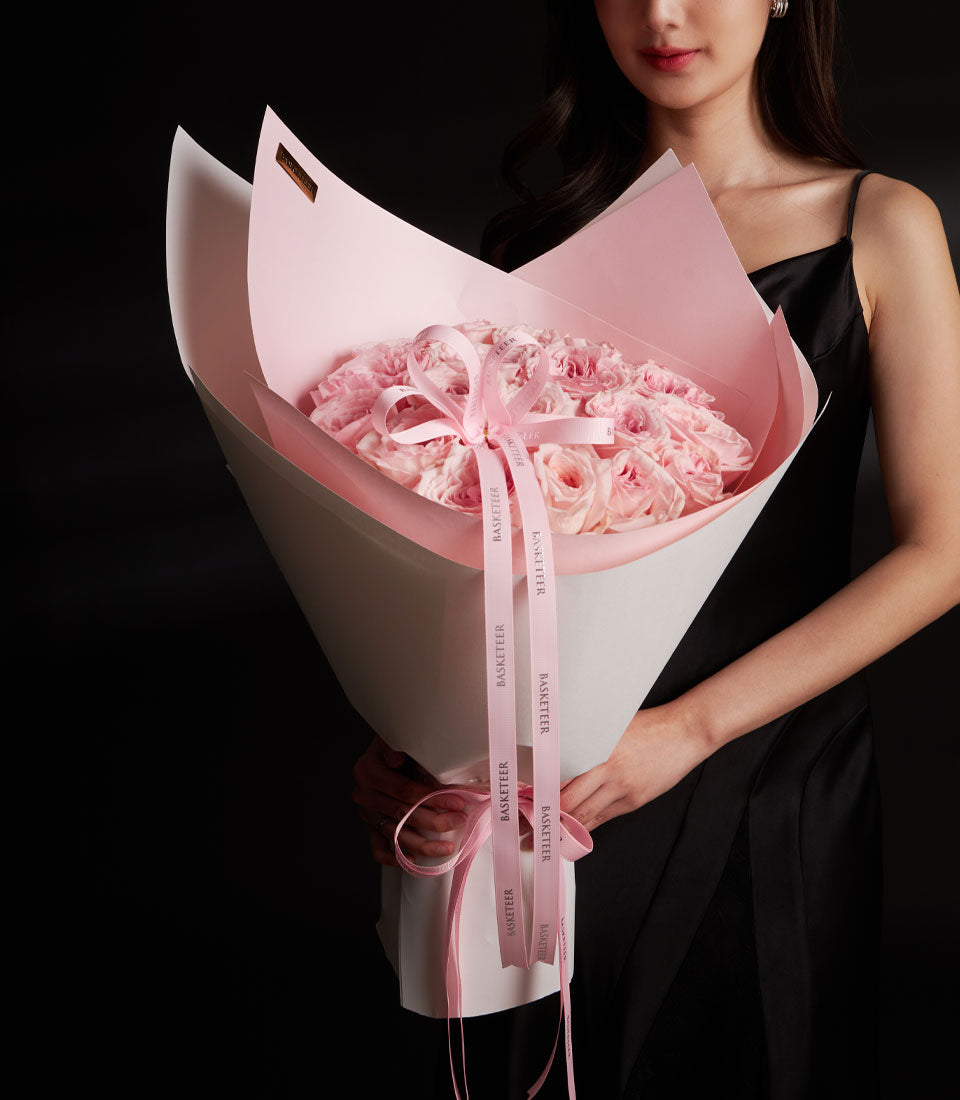 Luxurious pink O-Hara rose bouquet with white and pink wrapping for Valentine's Day